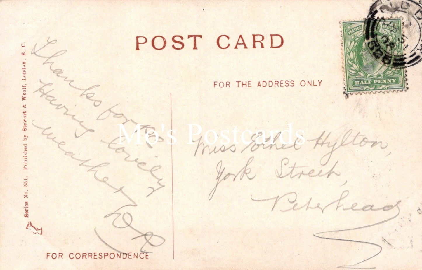 Vintage postcard with handwritten text and a stamp on a light brown background