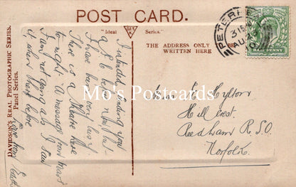 Vintage postcard with text and postage stamp.