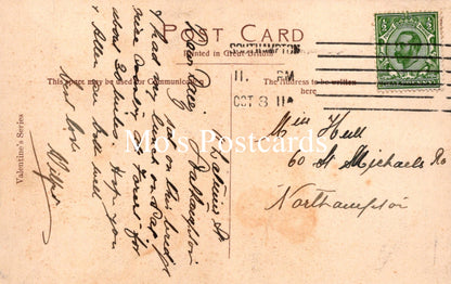 Vintage postcard with handwritten text and a stamp 