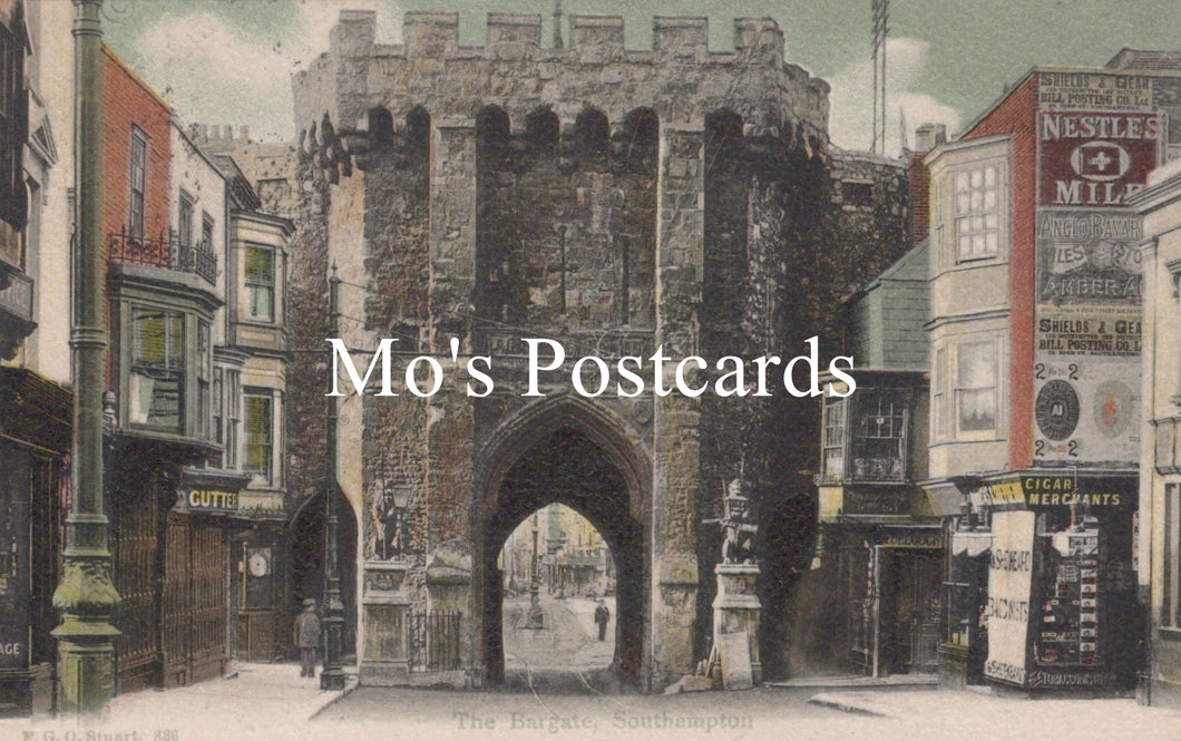 Vintage street scene with a large stone archway and colorful signs 