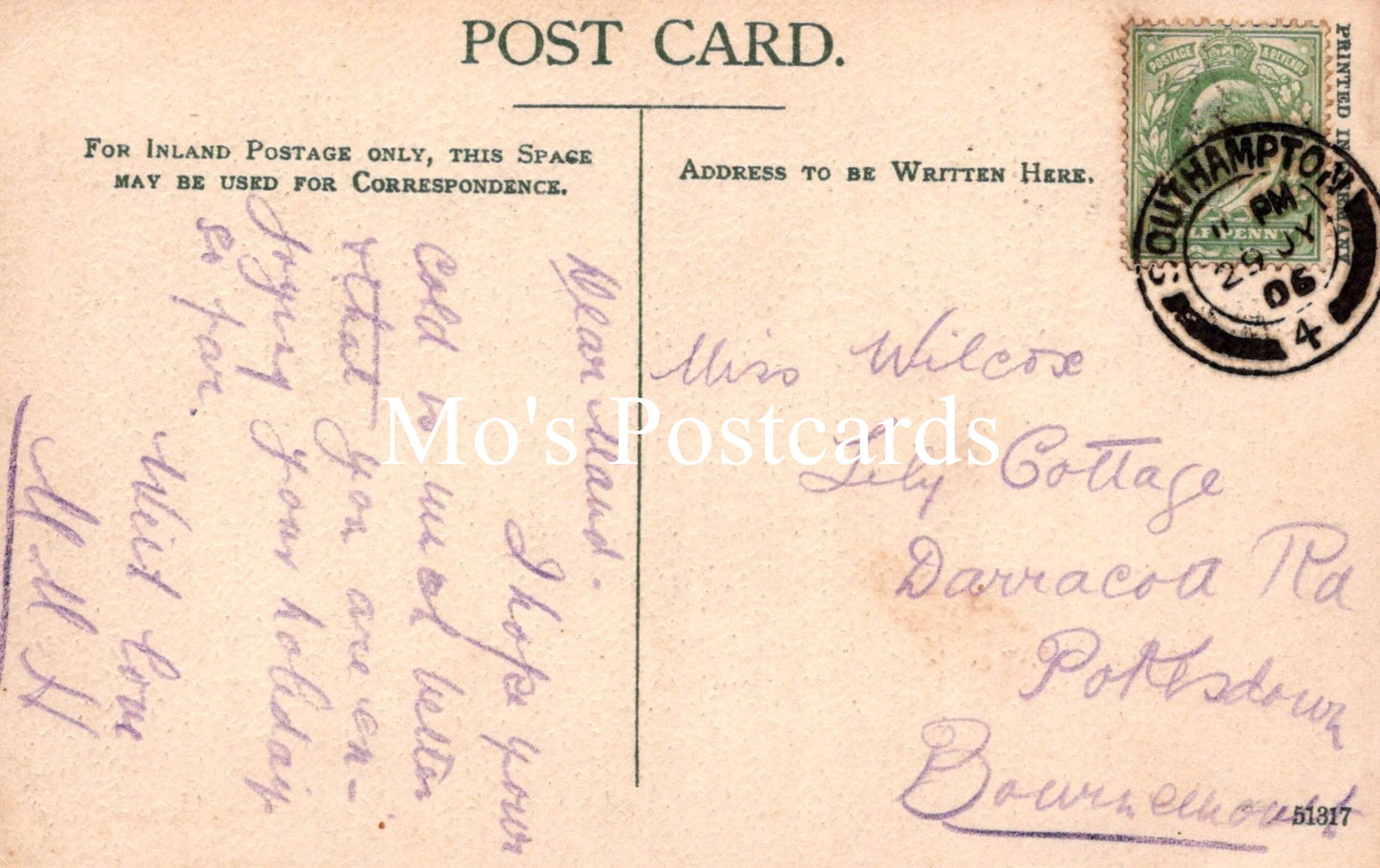 Vintage postcard with handwritten text and a stamp 