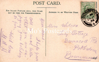 Vintage postcard with handwritten text and a stamp 