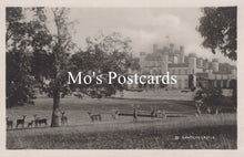 Load image into Gallery viewer, Vintage black and white postcard of a castle with deer in a park, featuring &#39;Mo&#39;s Postcards&#39; text.
