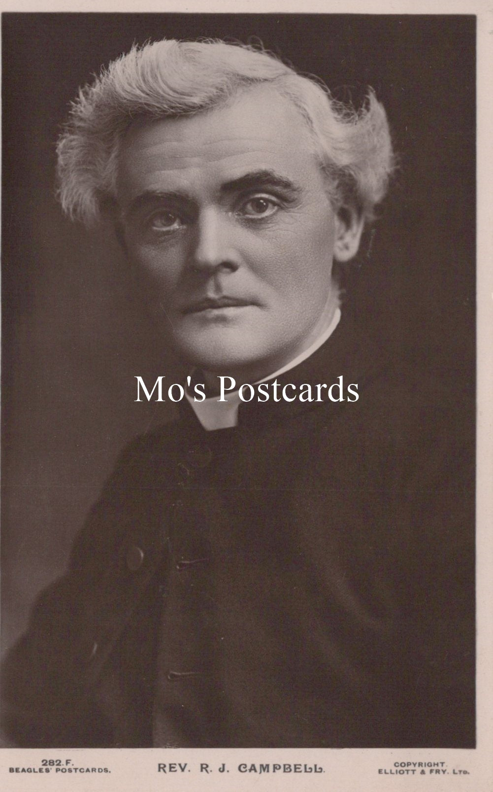 Black and white portrait of a man in a priest's outfit  