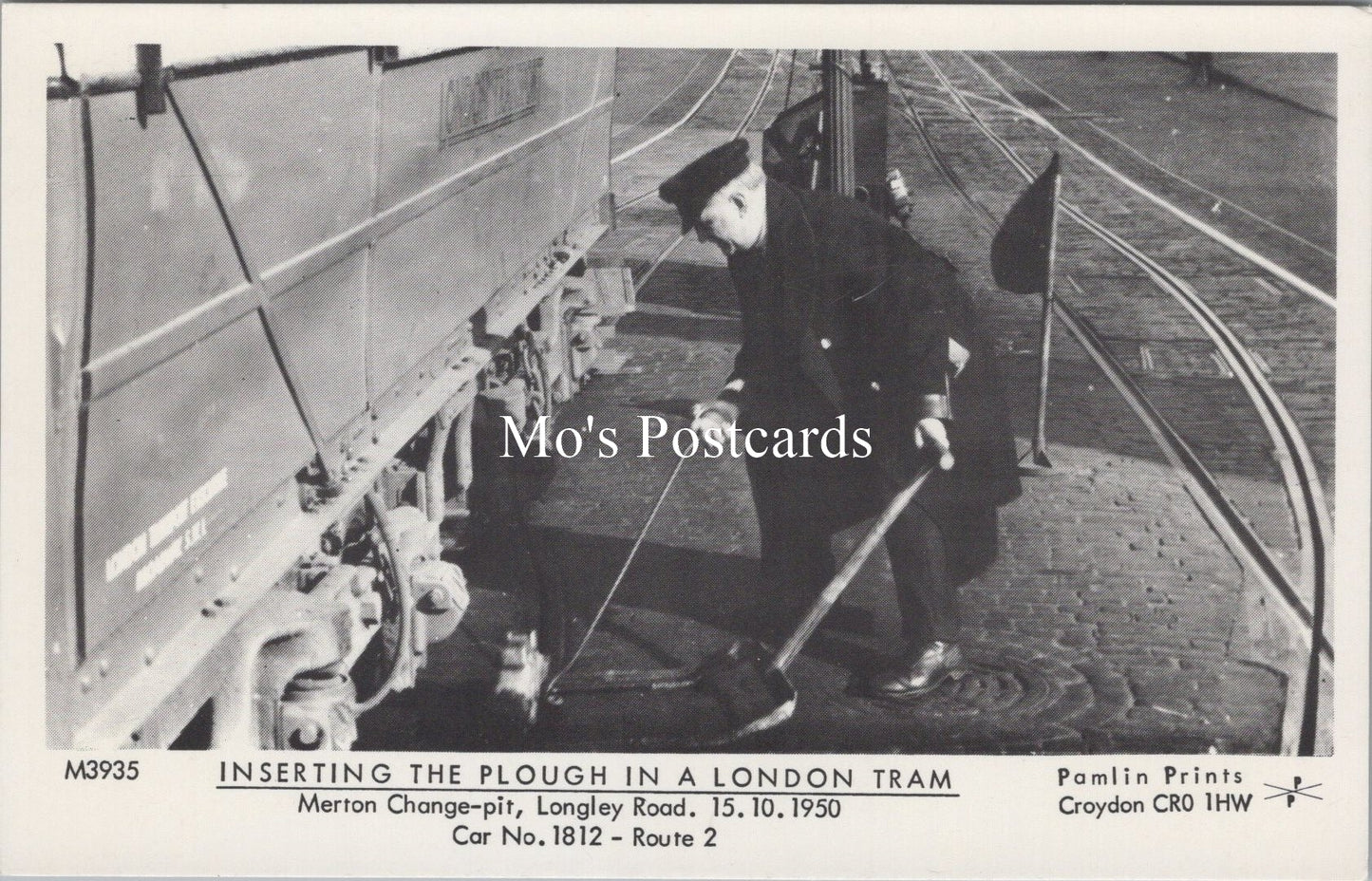 London Postcard - Inserting The Plough in a London Tram  SW17873