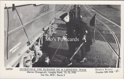 London Postcard - Inserting The Plough in a London Tram  SW17873