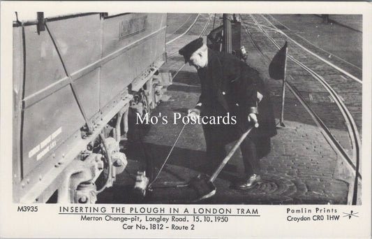London Postcard - Inserting The Plough in a London Tram  SW17873