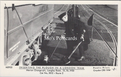London Postcard - Inserting The Plough in a London Tram  SW17873