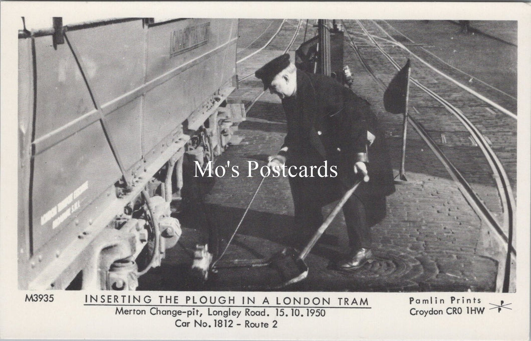 London Postcard - Inserting The Plough in a London Tram  SW17873