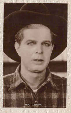 Vintage black and white photo of a man wearing a hat and plaid shirt with 'Hoot Gibson' text.