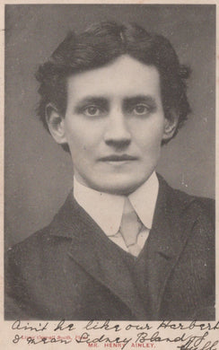 Black and white portrait of a young man in formal attire with text on the back.