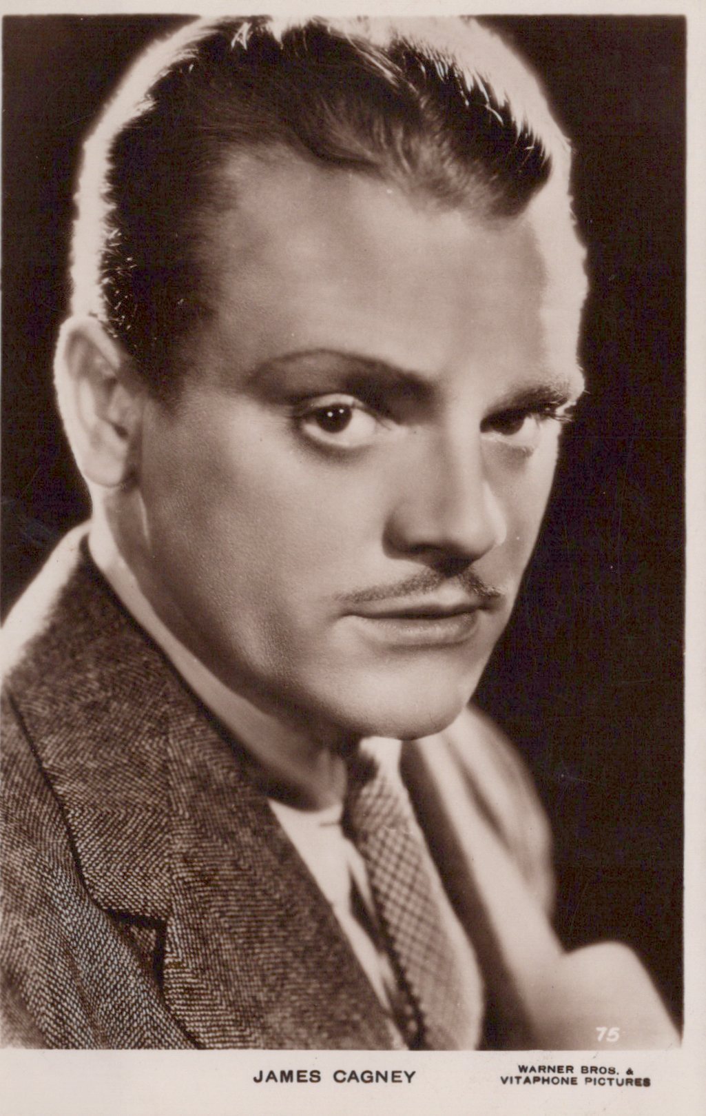 Vintage black and white portrait of a man with a serious expression, labeled 'James Cagney'.