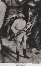 Load image into Gallery viewer, Black and white image of a character from &#39;Treasure Island&#39; holding a rifle in a cave setting.
