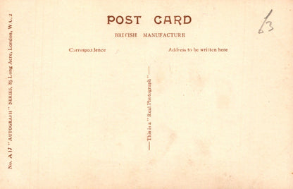 Back of a vintage postcard with text and a number '13' on a beige background