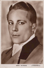 Load image into Gallery viewer, Vintage black and white portrait of a man in formal attire with a blurred background

