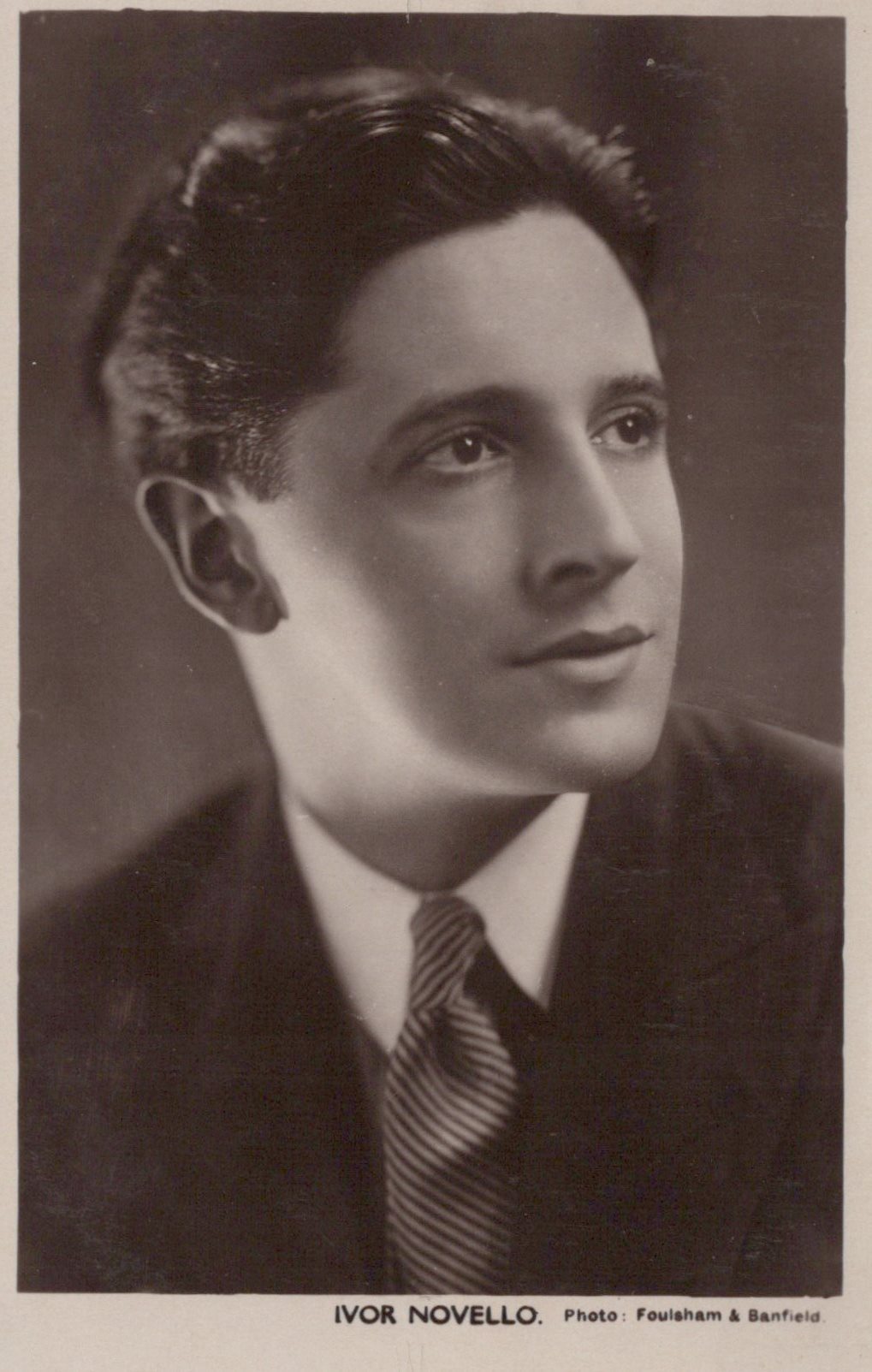 Vintage black and white portrait of Ivor Novello with a formal attire.