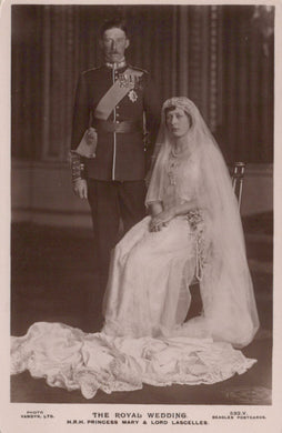 Vintage black and white photograph of a royal wedding couple in formal attire.