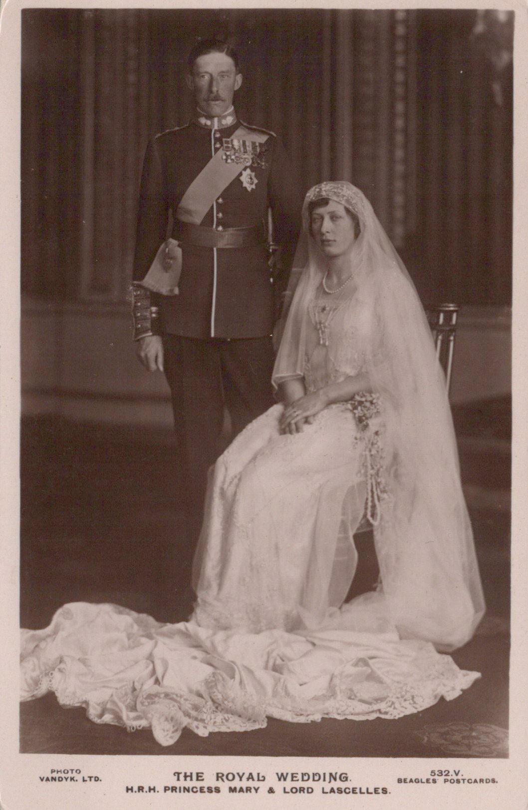 Vintage black and white photograph of a royal wedding couple in formal attire.