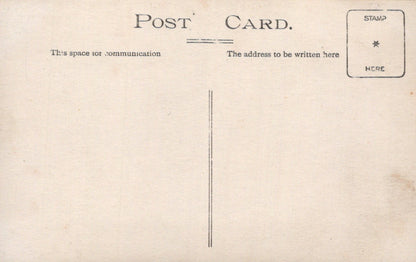 Vintage postcard with text and a stamp area on a beige background