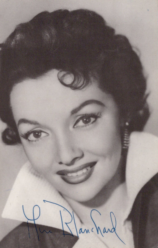 Black and white portrait of a woman with a signature at the bottom