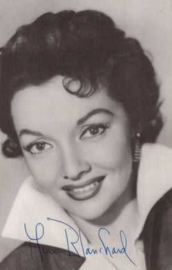 Black and white portrait of a woman with a signature at the bottom