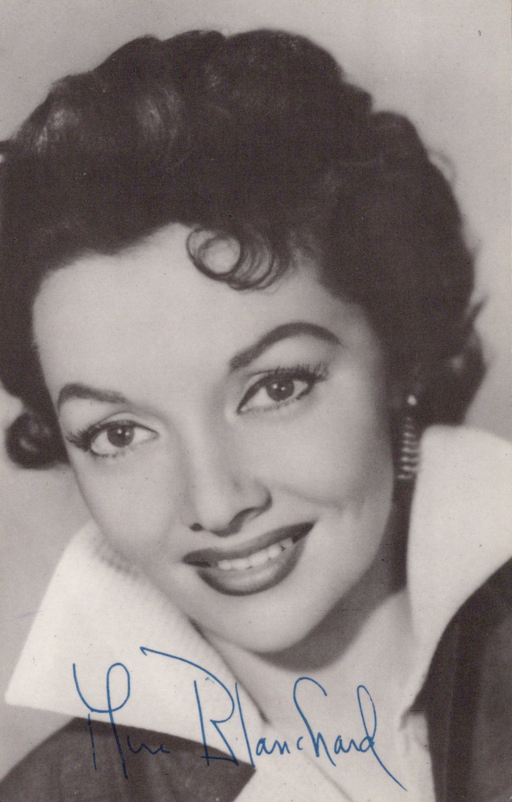 Black and white portrait of a woman with a signature at the bottom