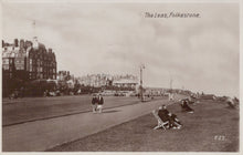 Load image into Gallery viewer, Vintage black and white photo of The Leas in Folkestone with people on the promenade and buildings in the background.
