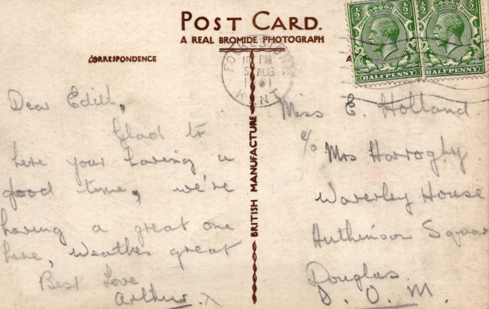 Vintage postcard with handwritten text and postage stamps