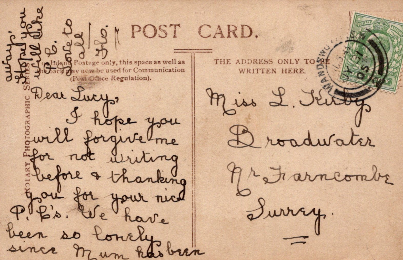 Vintage postcard with handwritten text and a stamp, featuring a brown background.