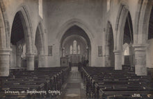 Load image into Gallery viewer, Interior of a church with pews and arches, vintage black and white photo.

