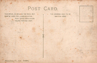 Vintage postcard with text and a rectangular area for writing on a textured beige background.