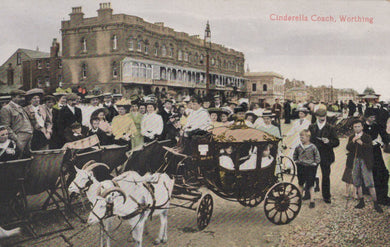 Vintage scene of a horse-drawn carriage with people on a street in Worthing, England.