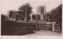 Load image into Gallery viewer, Gothic-style church with stone walls and a tall tower, surrounded by trees and a wooden gate.
