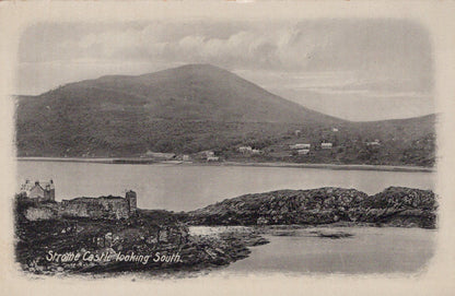 Vintage black and white postcard of a coastal scene with a castle and mountains.