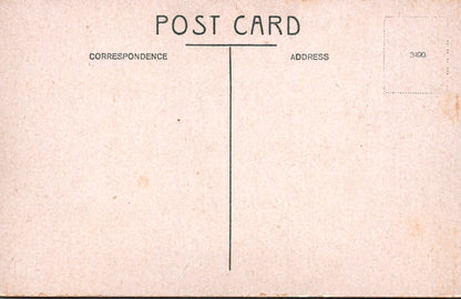 Vintage-style postcard with text and a line for correspondence address on a textured beige background.