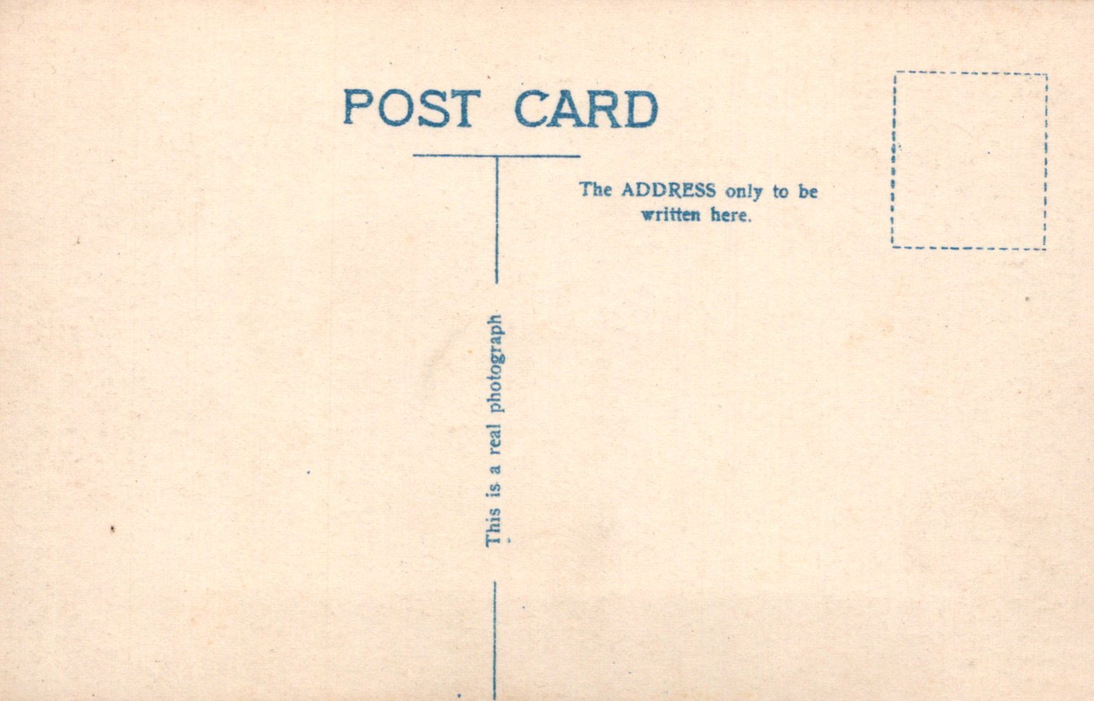 Back of a postcard with text and a rectangular area for writing.