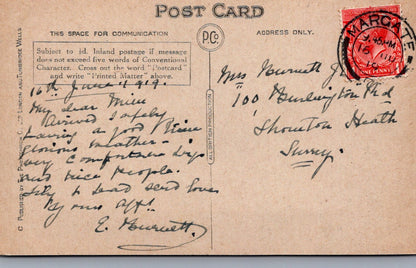 Vintage postcard with handwritten text and postage stamp, featuring a red cancel mark.
