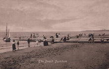 Load image into Gallery viewer, Vintage black and white postcard of a beach scene with people and boats.
