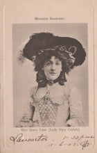 Load image into Gallery viewer, Vintage photograph of a woman wearing a large hat with decorative elements, dressed in an elegant outfit.
