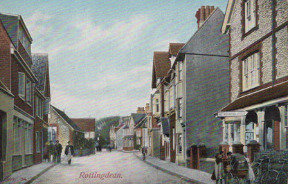 Vintage street scene with houses and people in a small town, labeled 'Rotherhithe'.