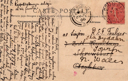 Vintage postcard with text and stamps, featuring a handwritten address.