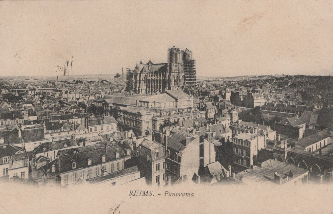 Vintage panoramic view of Reims with a prominent cathedral.