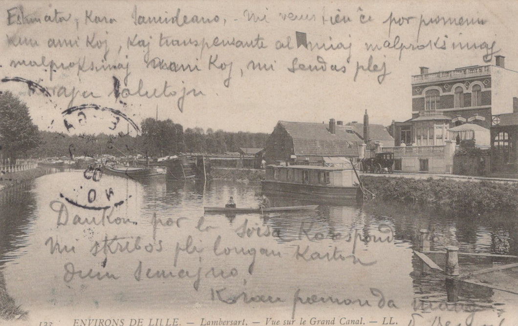 Vintage postcard of a canal scene with buildings and handwritten text