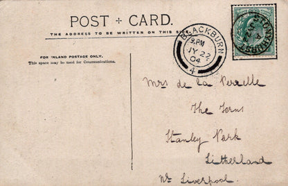 Vintage postcard with handwritten address and a stamp, featuring a brown background.