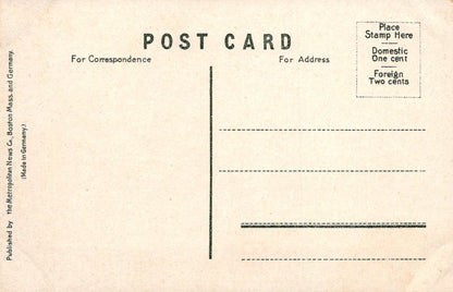 Vintage postcard with typewritten text on a beige background