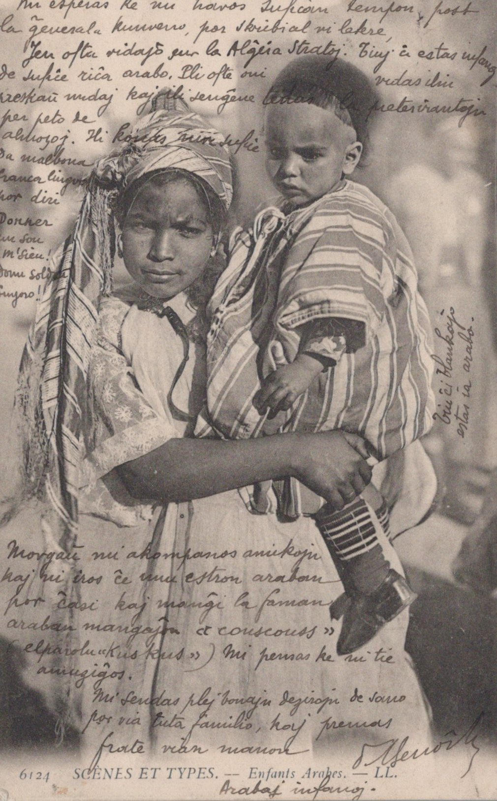 Vintage photograph of a woman holding a child with text overlay