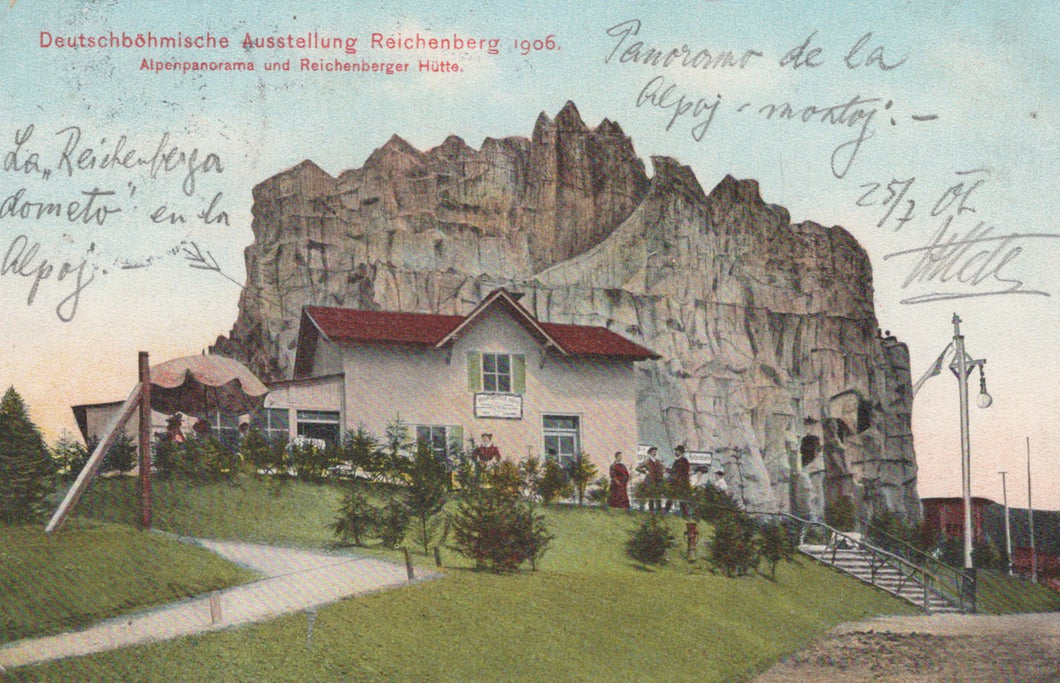 Vintage postcard of a building embedded in a rocky cliff with people around, labeled 'Deutschbähmische Ausstellung Reichenberg 1908'.
