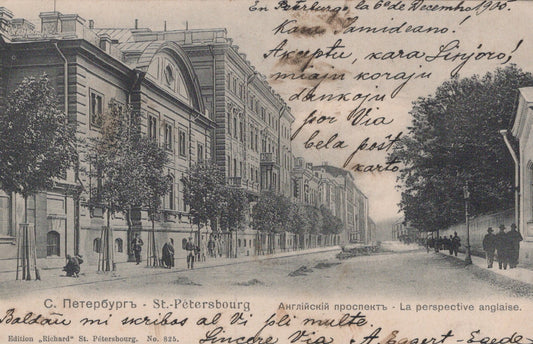 Vintage street scene in St. Petersburg with people and buildings on a snowy day.