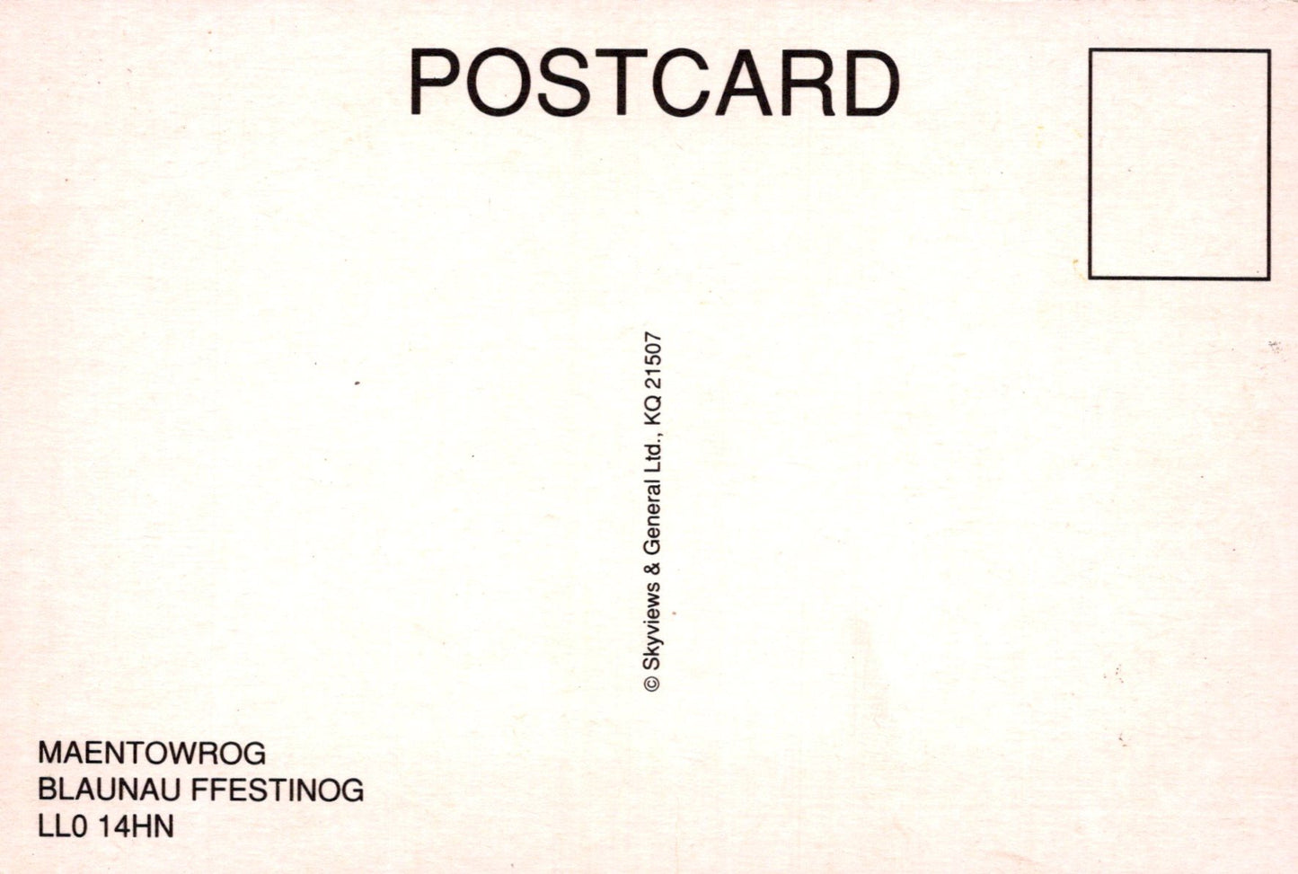 Back of a postcard with text and a small square for a message.