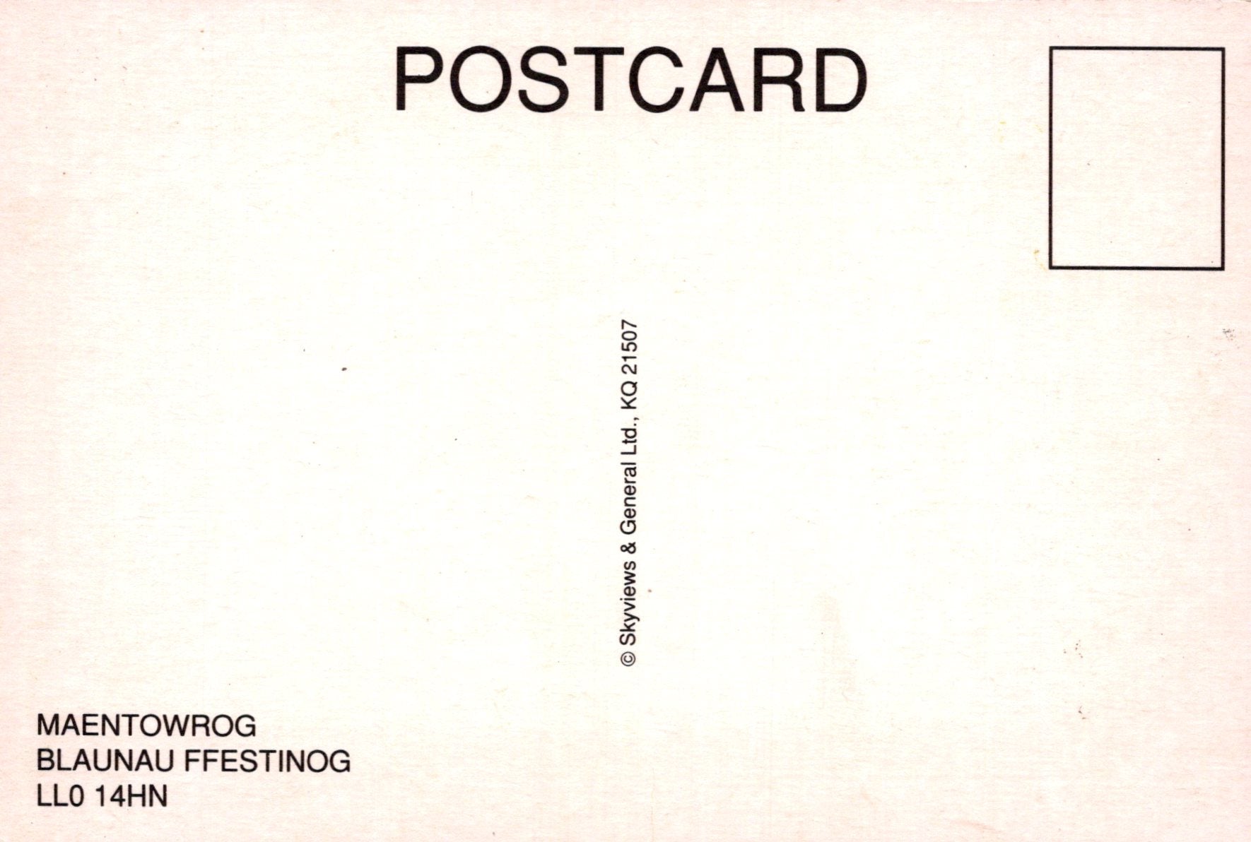 Back of a postcard with text and a small square for a message.